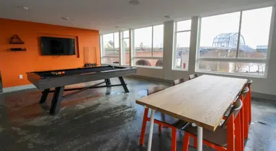 a ping pong table in a room with a pool table at CozySuites at ArtCincy in Cincinnati
