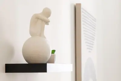 a statue of a woman sitting on a shelf at CozySuites at ArtCincy in Cincinnati