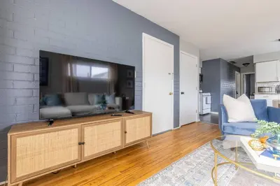 a living room with a large flat screen tv at Westlake Escape in Westlake