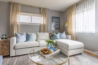 a living room with a couch and a glass table at Westlake Escape in Westlake