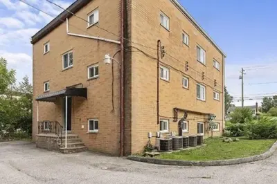 a large brick building with stairs on the side of it at Westlake Escape in Westlake