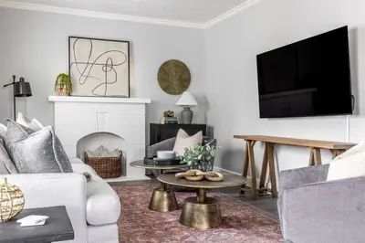 a living room with a couch and a table at Quiet Modern Home w/ Hot Tub! in Parma