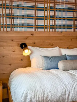 a bedroom with a bed with a light on it at Explorer Rest & Recreation in Sandusky