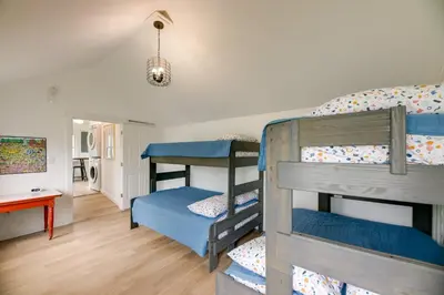 a bedroom with two bunk beds in a room at Modern Family Home in Mason with Backyard and Fire Pit in Mason