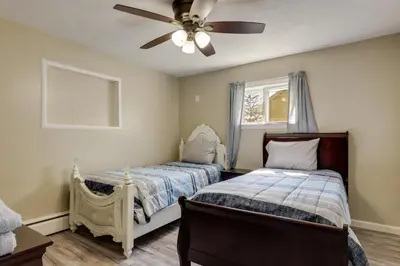a bedroom with two beds and a ceiling fan at Pet-Friendly Ohio Escape with Deck and Community Dock! in Celina
