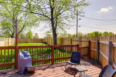 a deck with chairs and a fence at Pet-Friendly Ohio Escape with Deck and Community Dock! in Celina