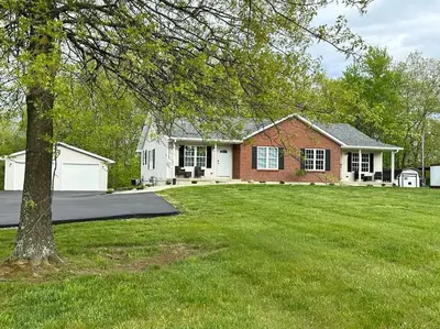 a house with a green lawn in front of it at Suite 1 in Butler