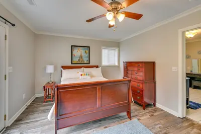 a bedroom with a bed and a ceiling fan at Home with Private Pool - 15 miles to Ark Encounter! in Berry