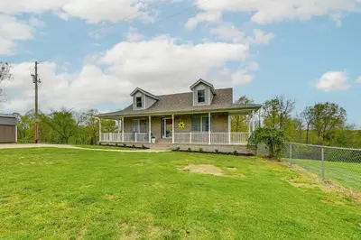a house with a green lawn in front of it at Home with Private Pool - 15 miles to Ark Encounter! in Berry