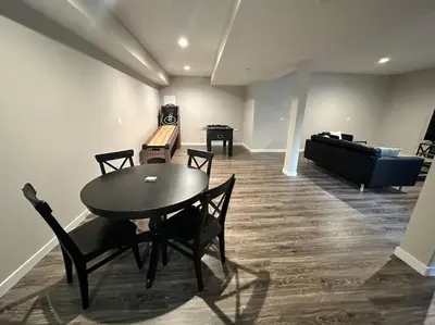 a room with a table and chairs and a couch at Suite 2 in Butler