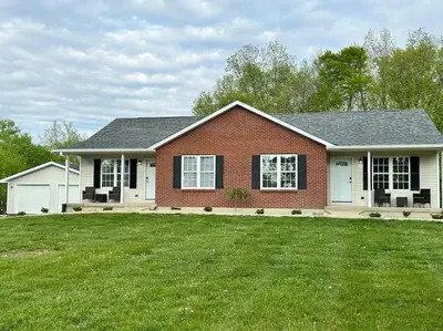 a house with a green lawn in front of it at Suite 2 in Butler