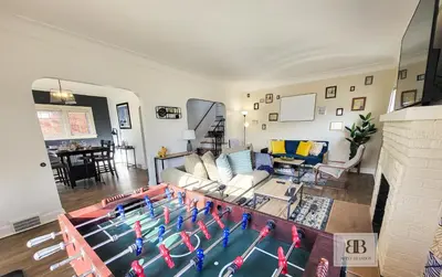 a living room with a pool in the middle of it at KingBed15 Mins to DTWN, 3 miles to CLE Clinic & CWRU in Cleveland Heights