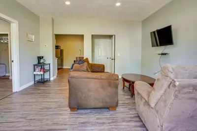 a living room with a couch and a table at Zanesville Vacation Rental Near Downtown in Zanesville