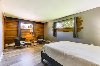 a bedroom with a bed and a table and chairs at Indian Lake Vacation Rental with Fire Pit and Sauna in Lakeview