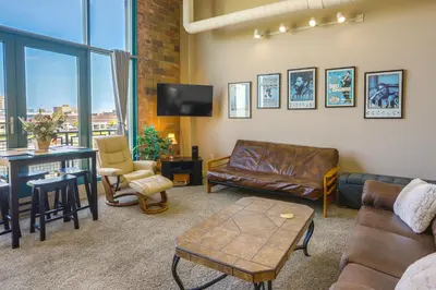 a living room with a couch and a table at Waterfront Sandusky Vacation Rental Downtown! in Sandusky