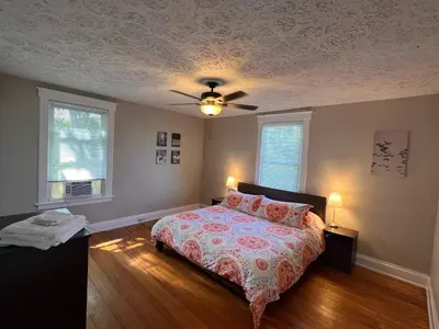 a bedroom with a bed and a ceiling fan at Rolston 2, Two Bedroom near Xavier Downtown in Bellevue