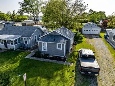 an aerial view of a house with a truck parked in the yard at Recharge & Reconnect Your cozy Vermilion nest in Vermilion