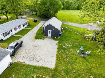 an aerial view of a house and a car parked in a yard at Renovated Retreat Home in Huron, close to beaches in Huron