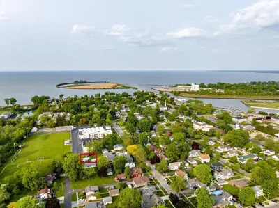 an aerial view of a small town next to the water at Renovated Retreat Home in Huron, close to beaches in Huron