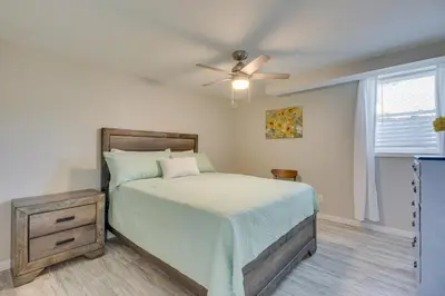 a bedroom with a bed and a ceiling fan at Home with Hot Tub and Deck about 3 Mi to Ark Encounter! in Williamstown