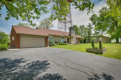 a house with a driveway in front of it at Home with Hot Tub and Deck about 3 Mi to Ark Encounter! in Williamstown