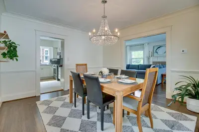 a dining room and living room with a table and chairs at Pet-Friendly Cincinnati Retreat with Hot Tub in Blue Ash