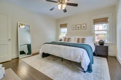 a bedroom with a bed and a ceiling fan at Pet-Friendly Cincinnati Retreat with Hot Tub in Blue Ash