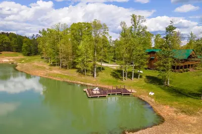 an aerial view of a lake with a cabin at Fraziers Bottom Cabin on 800 Acres of Land with Lake in Fraziers Bottom