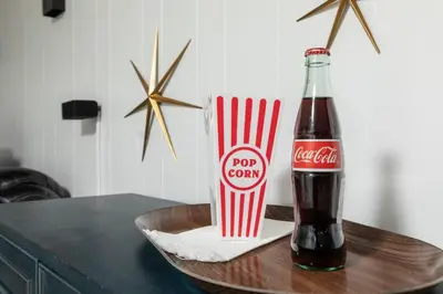 a coke bottle and a popcorn container on a table at Parma Home w/ Hot Tub and Arcade room! in Parma