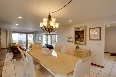 a dining room and living room with a table and chairs at Waterfront Luna Pier Home 14 Mi to Downtown Toledo in Erie