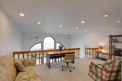 a living room with a couch and a desk at Waterfront Luna Pier Home 14 Mi to Downtown Toledo in Erie