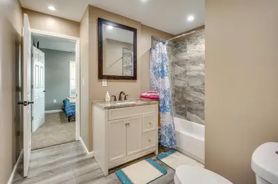 a bathroom with a sink and a shower at Waterfront Buckeye Lake Vacation Rental with Hot Tub in Hebron