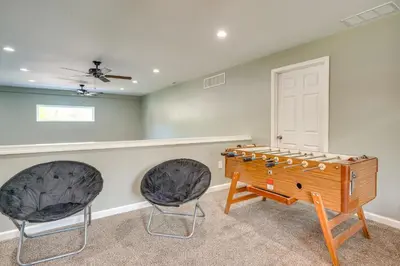 a room with a ping pong table and two chairs at Waterfront Buckeye Lake Vacation Rental with Hot Tub in Hebron