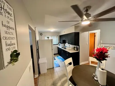 a kitchen and dining room with a table and a dining room at Red Ruby Spacious 2 Bedroom Apt 10 Minutes to Dwntwn in Cincinnati