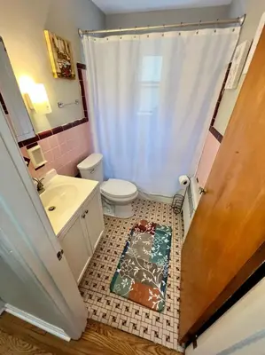 a bathroom with a toilet and a sink and a shower at Red Ruby Spacious 2 Bedroom Apt 10 Minutes to Dwntwn in Cincinnati