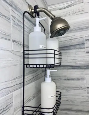 a black rack with three white bottles on it at Amazing Downtown Views - 3 Minutes to Downtown! in Cincinnati