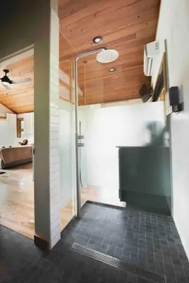 a bathroom with a shower with a glass door at Lake with Dock and Hot Tub Hocking Hills Cabin in Rockbridge