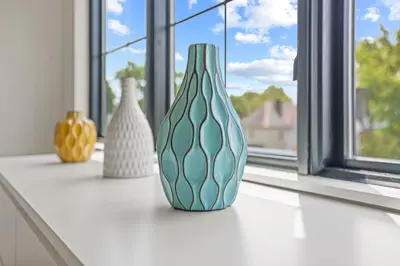a row of vases sitting on a window sill at Chic Retreats in Columbus in Columbus