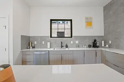 a large kitchen with a sink and a window at Chic Retreats in Columbus in Columbus