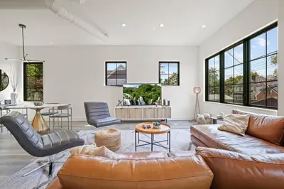a living room with a couch and a table at Chic Retreats in Columbus in Columbus