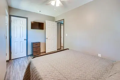 a bedroom with a large bed and a tv at Zanesville Vacation Rental 2 Mi to Downtown! in Zanesville