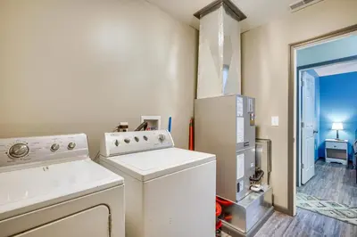 a small laundry room with a washer and dryer at Zanesville Vacation Rental 2 Mi to Downtown! in Zanesville
