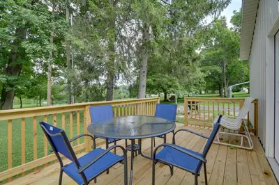 a patio with a table and chairs on a deck at Zanesville Vacation Rental 2 Mi to Downtown! in Zanesville