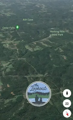 a sign for the kazakhstan state park with a green circle at The Lookout in Logan