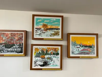a group of four pictures hanging on a wall at Trendy in Tremont, CLE (Lower) in Cleveland