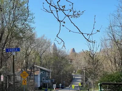 a blue street sign on a city street with buildings at Trendy in Tremont, CLE (Lower) in Cleveland