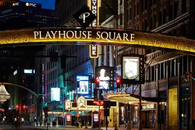 a sign for playhouse square on a city street at night at Trendy in Tremont, CLE (Lower) in Cleveland
