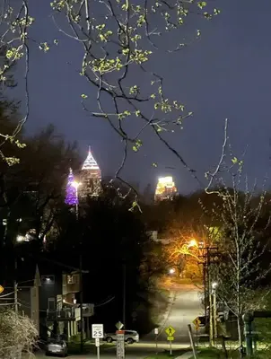 a city street at night with lit up buildings at Trendy in Tremont, CLE (Lower) in Cleveland