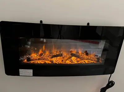 a fireplace with a bunch of fire in it at Trendy in Tremont, CLE (Lower) in Cleveland