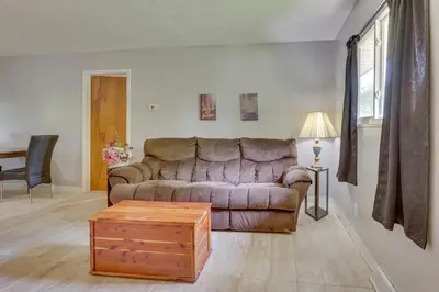 a living room with a couch and a coffee table at Cozy Youngstown Apartment with Central AandC and Heating in Youngstown